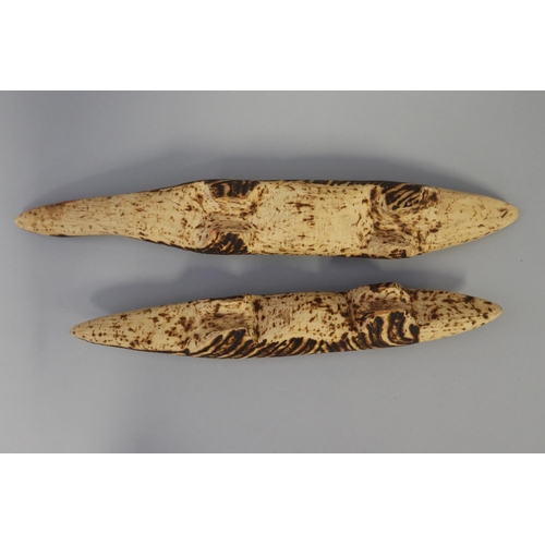 845 - Bobby Tilmouth (1942-.) Australia (Aboriginal), two carved pokerwork lizards, 34 cm & 28.5 cm  (2)