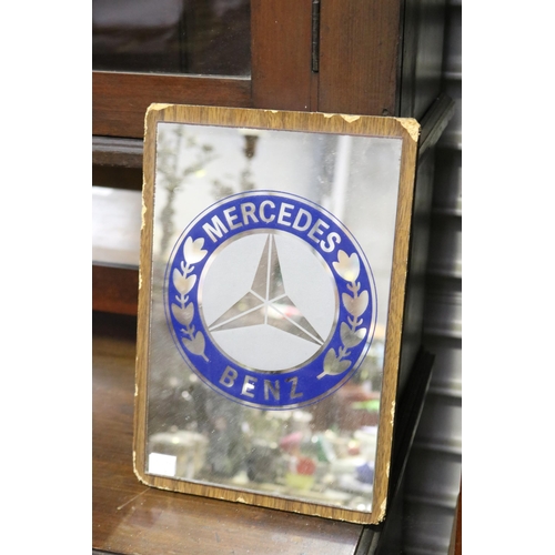846 - Mercedes Benz small mirror, mounted to board, approx 33cm H x 23.5cm W