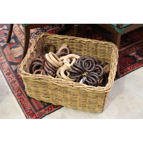 675 - Cane basket with curtain rod rings, basket approx 30cm H x 66cm W x 50cm D