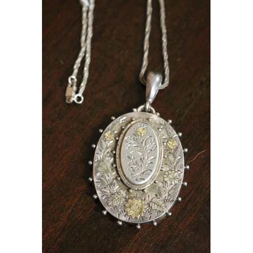 811 - Antique sterling silver locket Birmingham 1901-02, on a later silver chain