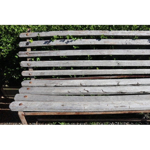 23 - Rustic garden bench with wooden slats and flat bar iron frame, approx 196cm W