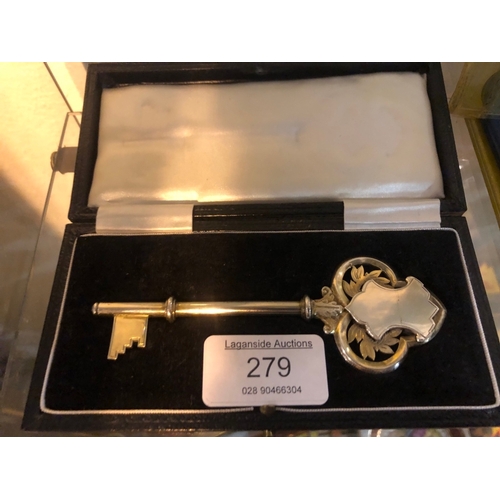 279 - Ornate silver key in case