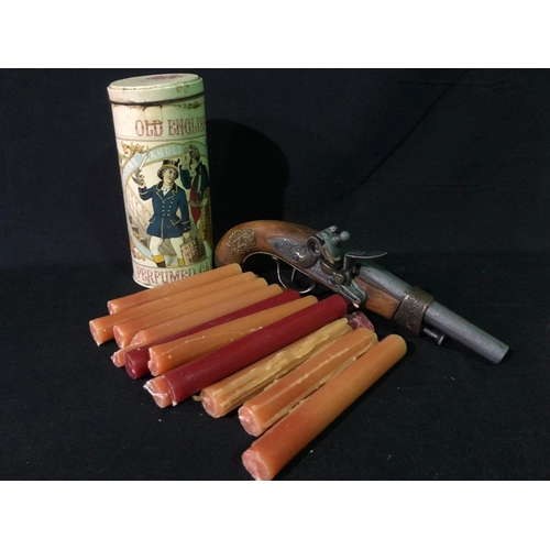 306 - Quantity of candles and a replica pistol