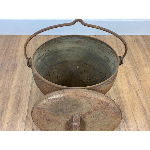 159 - Large cast iron pot and lid, 50cm x 33cm