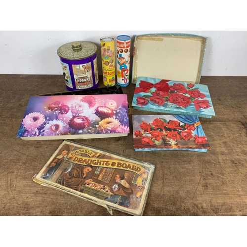 219 - Vintage chocolate and sweets containers with board game etc