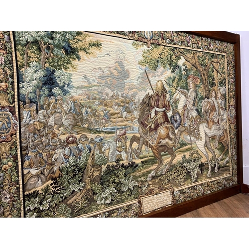 1063 - Large machine made tapestry on framed stand, 146cm x 106cm