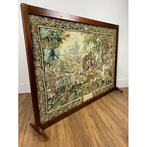 1063 - Large machine made tapestry on framed stand, 146cm x 106cm