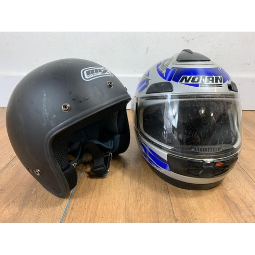 46 - 2 motorbike helmets