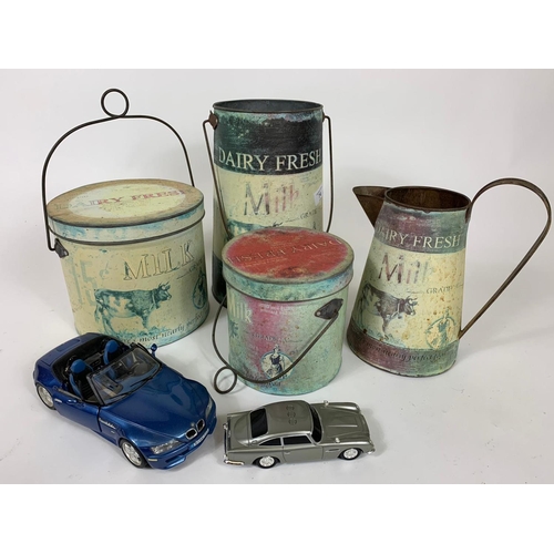 74 - Quantity of kitchen tins, jug and 2 model cars