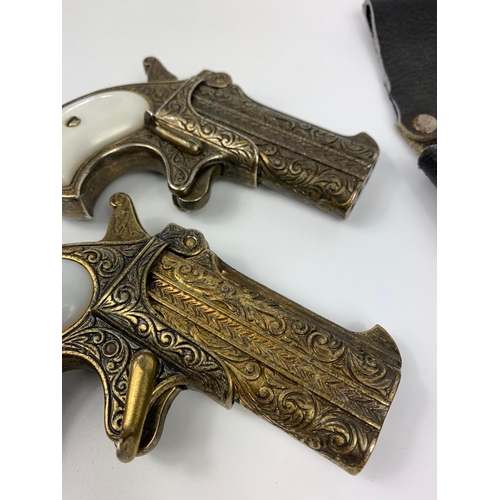 149 - Pair of replica pistols with holster