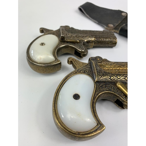 149 - Pair of replica pistols with holster