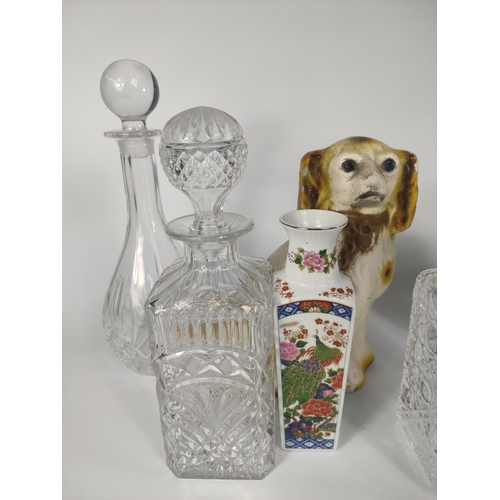 213 - Pair of pottery dogs, 5 crystal decanters and a pair of vases