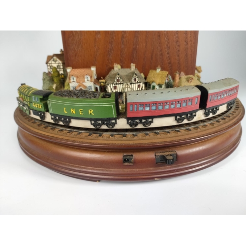 246 - Flying Scotsman themed clock with rotating train. 44cm