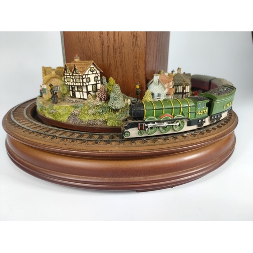 246 - Flying Scotsman themed clock with rotating train. 44cm