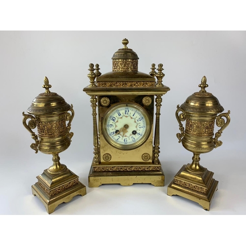 8 - Ornate 19th century French brass cased clock with garnitures, 33cm