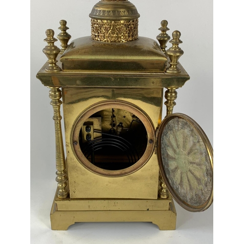 8 - Ornate 19th century French brass cased clock with garnitures, 33cm