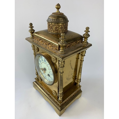 8 - Ornate 19th century French brass cased clock with garnitures, 33cm