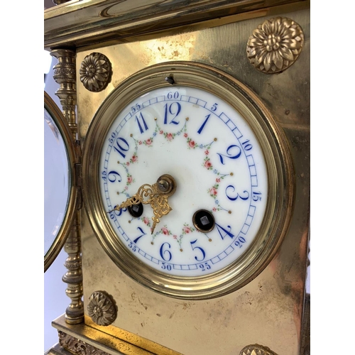 8 - Ornate 19th century French brass cased clock with garnitures, 33cm