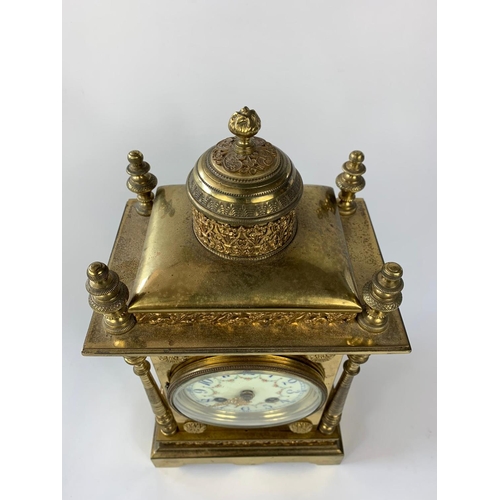 8 - Ornate 19th century French brass cased clock with garnitures, 33cm