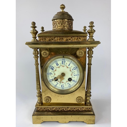 8 - Ornate 19th century French brass cased clock with garnitures, 33cm