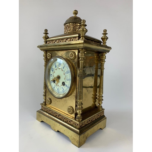 8 - Ornate 19th century French brass cased clock with garnitures, 33cm