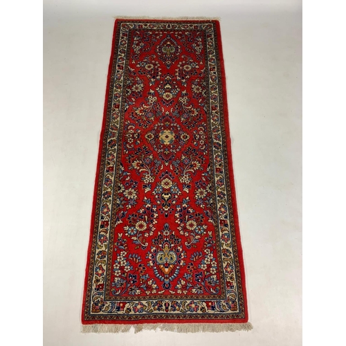 1014 - Middle Eastern hand knotted wool runner, 212cm x 82cm