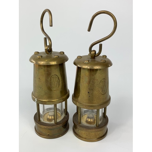 175 - Pair of small brass miner lamps with Prince of Wales feather stamp, 10cm