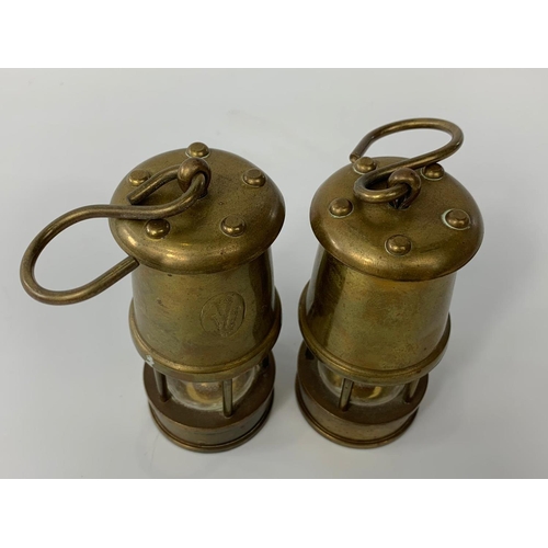 175 - Pair of small brass miner lamps with Prince of Wales feather stamp, 10cm