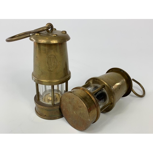 175 - Pair of small brass miner lamps with Prince of Wales feather stamp, 10cm