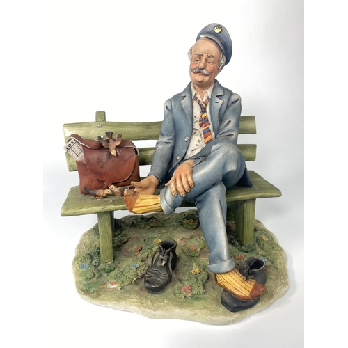 191 - Capodimonte figure, 'Postman.' 23 x 24cm