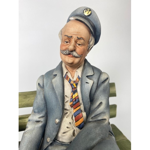 191 - Capodimonte figure, 'Postman.' 23 x 24cm