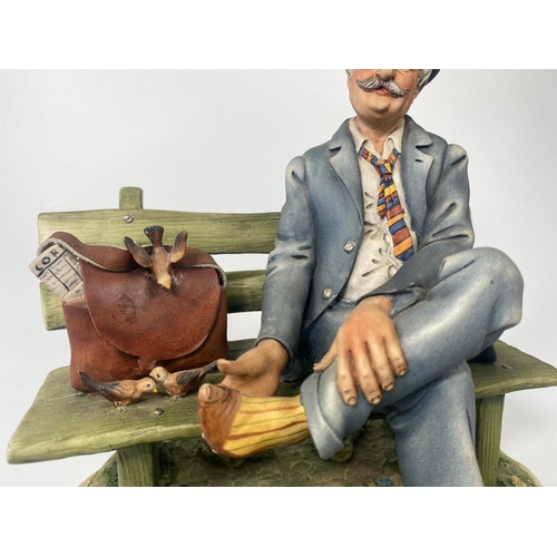 191 - Capodimonte figure, 'Postman.' 23 x 24cm