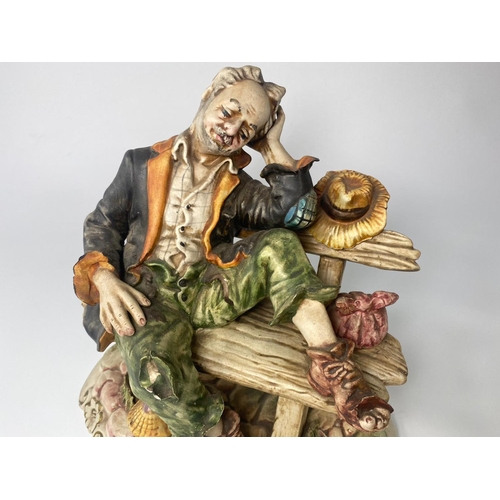 194 - Capodimonte figure, Tramp On A Bench. 26cm