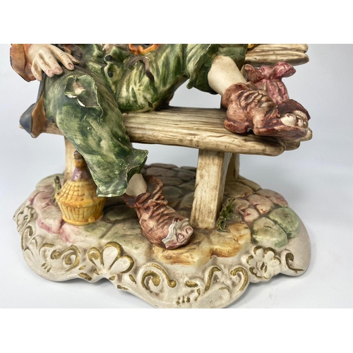 194 - Capodimonte figure, Tramp On A Bench. 26cm