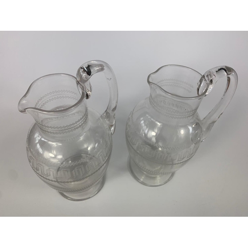 207 - Pair of Victorian glass jugs. 17cm