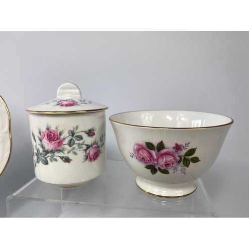 223 - Part Queen Anne tea set with 2 Crown Royal saucers and Royal Grafton sugar container.