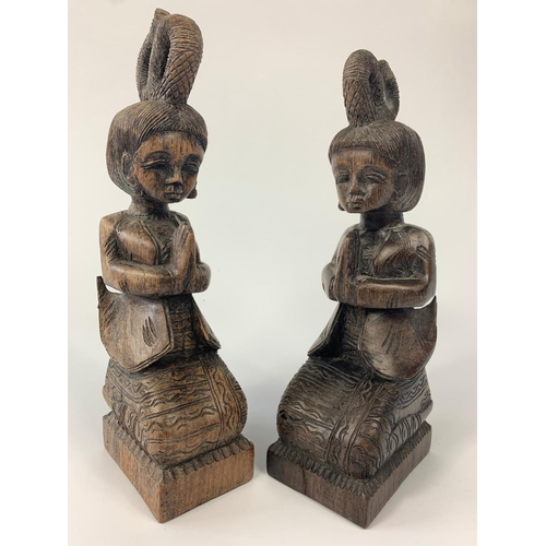 232 - Pair of rosewood deity figures. Biggest figure is 22cm