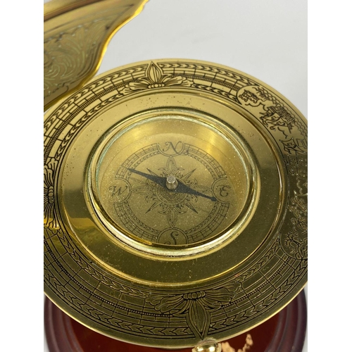 279 - Brass clock barometer and brass table top compass.