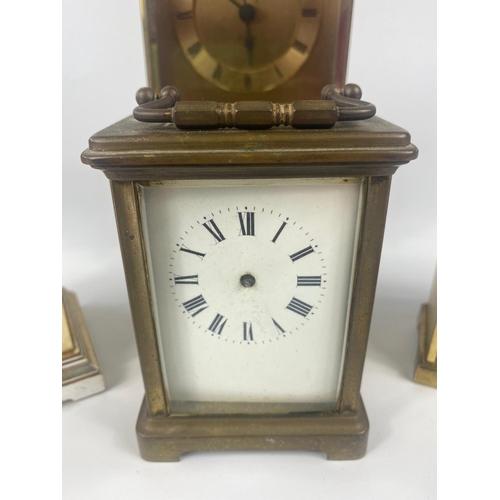 310 - Vintage carriage clock with 4 other modern clocks.