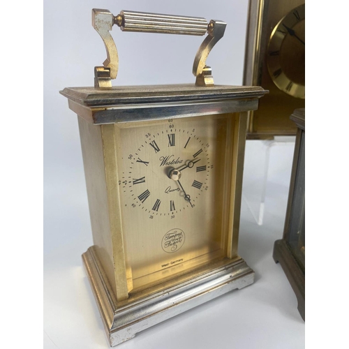 310 - Vintage carriage clock with 4 other modern clocks.