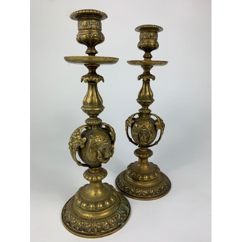 43 - Pair of late 19th century ornate candlesticks, 24cm