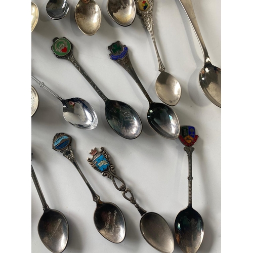 582I - Quantity of collectable spoons with a Limoges porcelain brooch