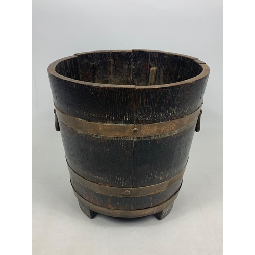 86 - Early 20th century oak brass bound bucket, 38cm