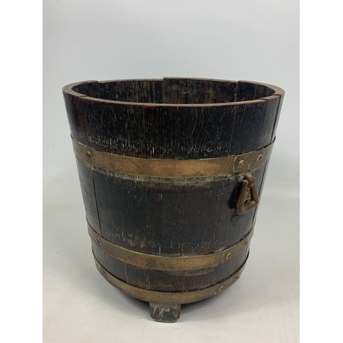 86 - Early 20th century oak brass bound bucket, 38cm