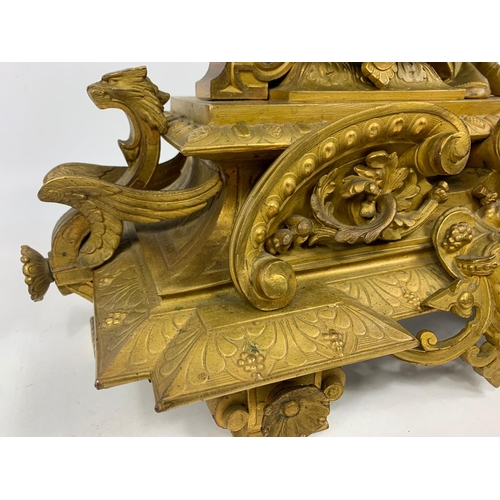 19 - Large 19th century ornate gilded brass clock by PH Mourey. 53cm x 59cm