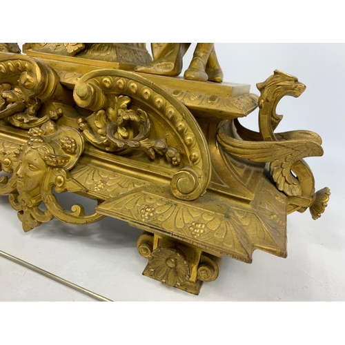 19 - Large 19th century ornate gilded brass clock by PH Mourey. 53cm x 59cm