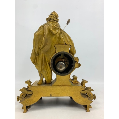 19 - Large 19th century ornate gilded brass clock by PH Mourey. 53cm x 59cm