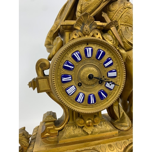 19 - Large 19th century ornate gilded brass clock by PH Mourey. 53cm x 59cm