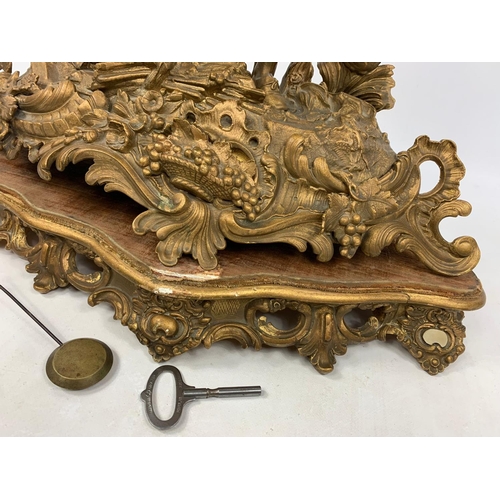 22 - Large 19th century gilded brass clock, 51cm x 51cm