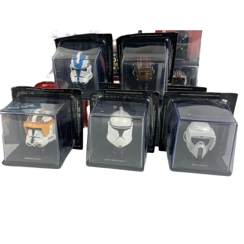 66 - Star Wars cased helmets with book